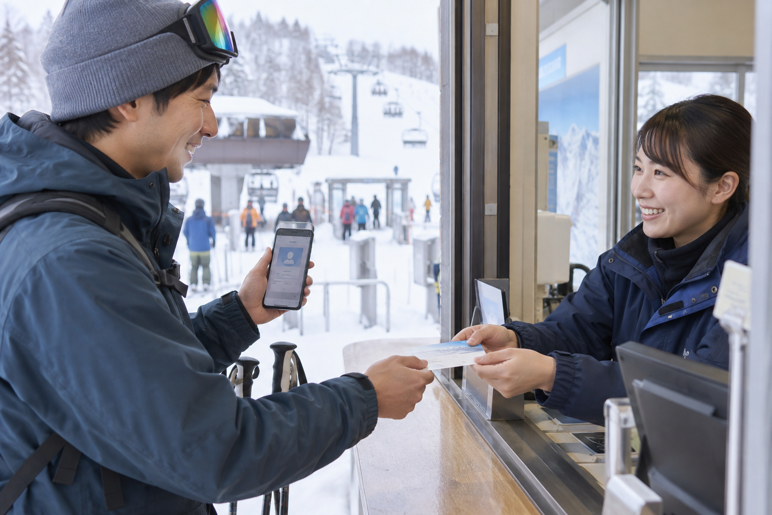 スマートフォンの会員画面を提示してリフト券を受け取る様子